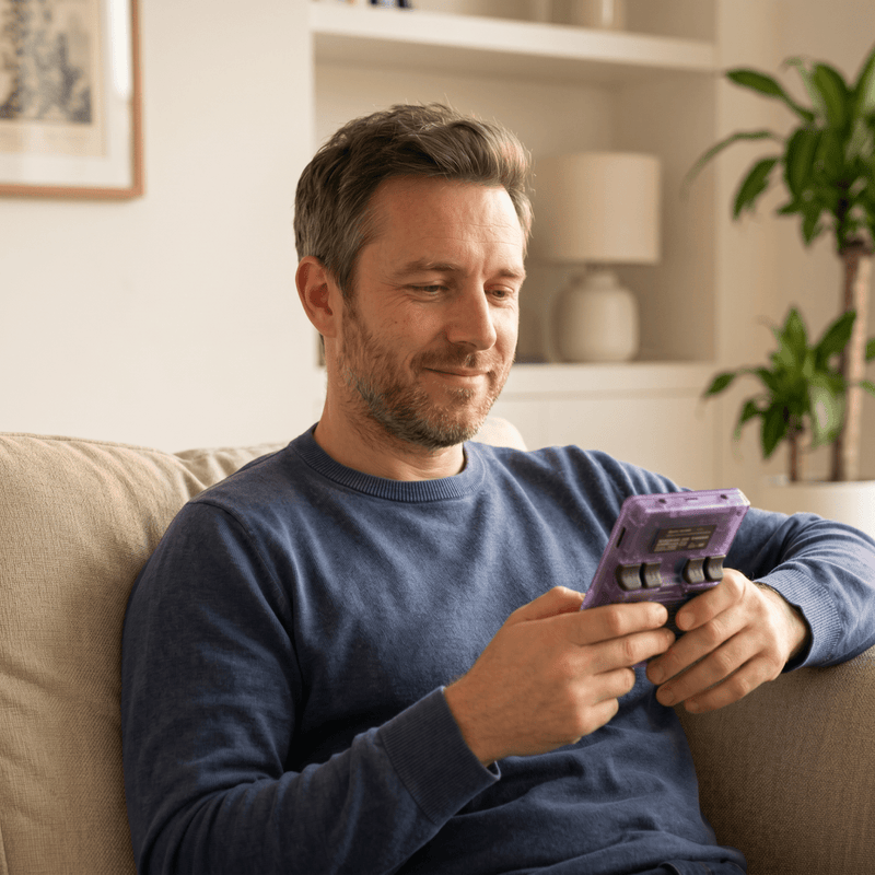 Person playing the Valuethese Pro 2.0 R36S retro gaming console at home